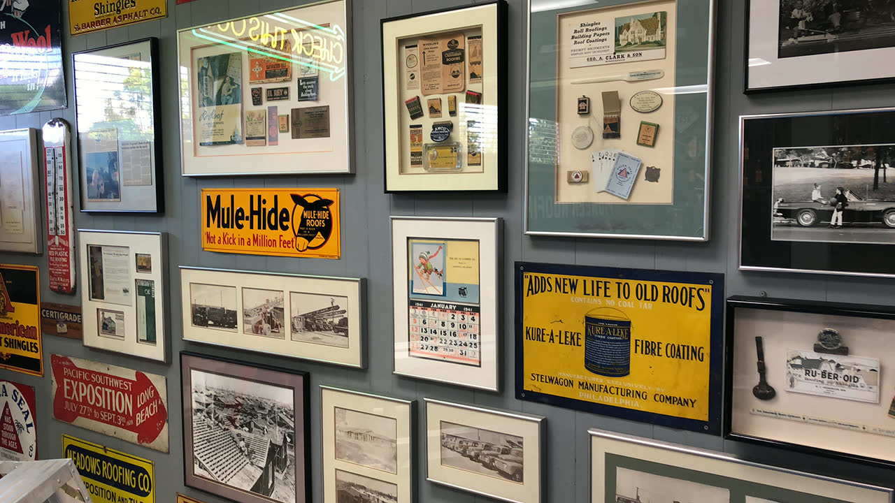 80 years of roofing history on the showroom wall